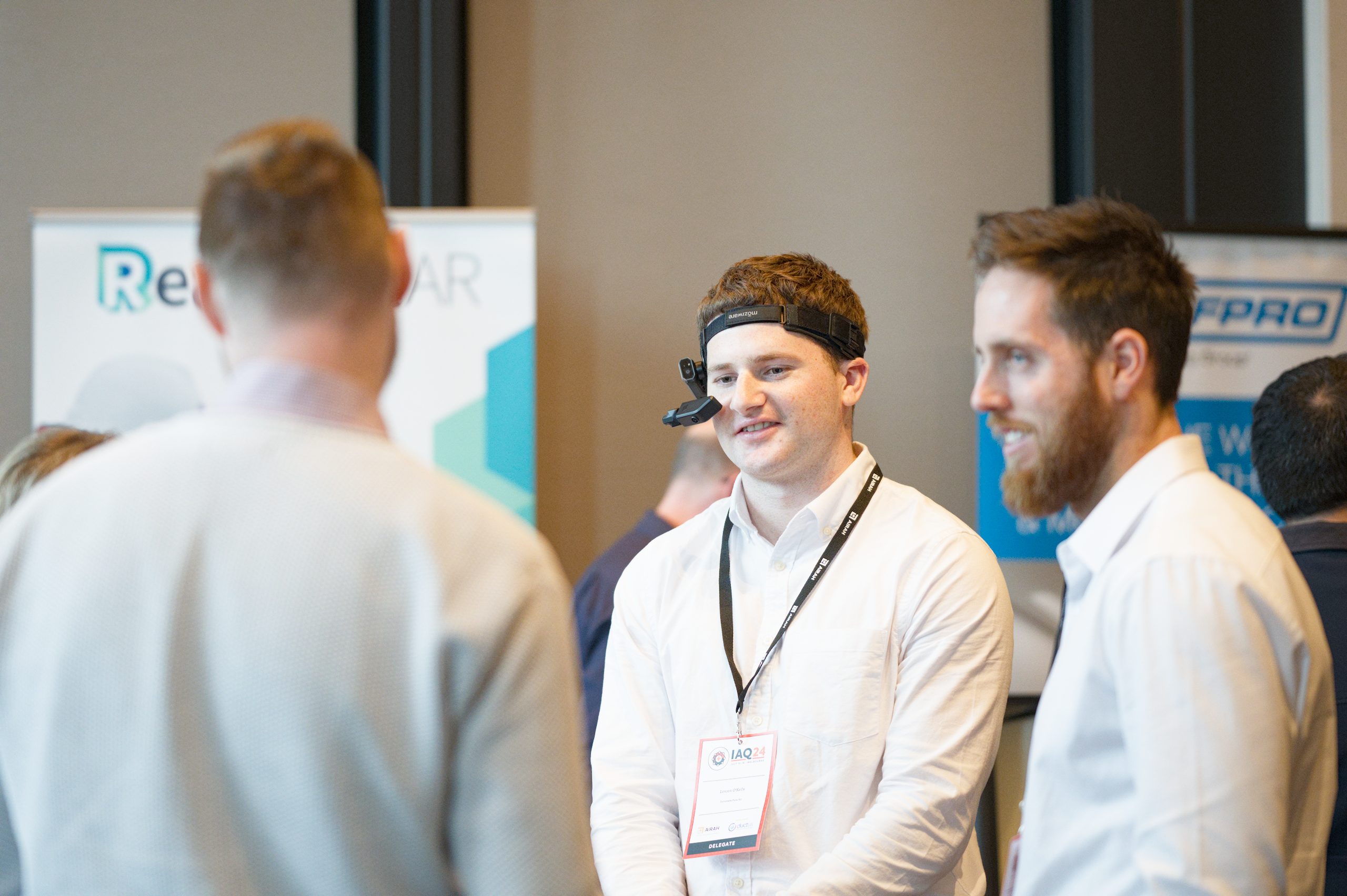 Photo of industry exhibitor with wearing tech headpiece